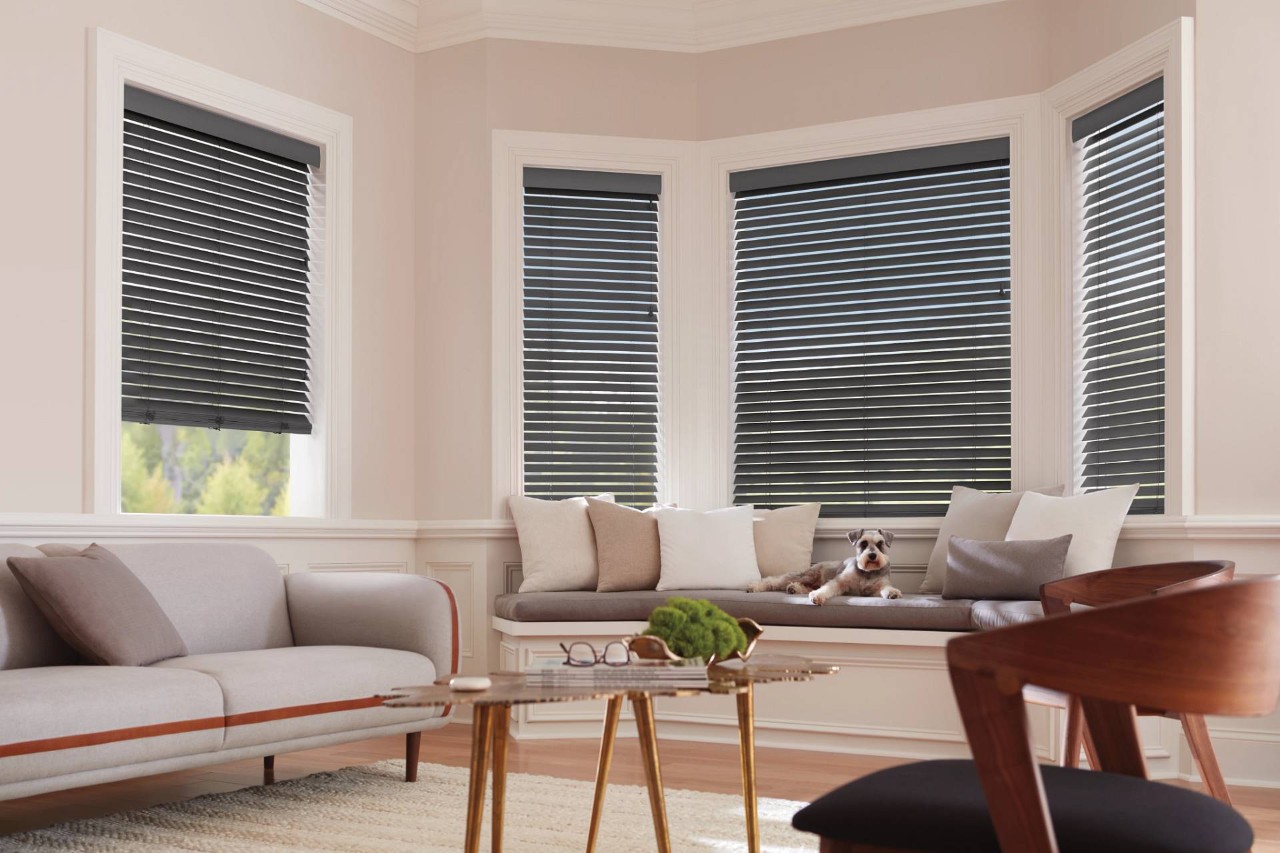 Hunter Douglas Parkland® Wood Blinds covering bay windows in a home near Mount Pleasant, SC